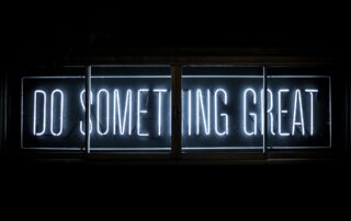 Neon lettering spelling "Do something Great"