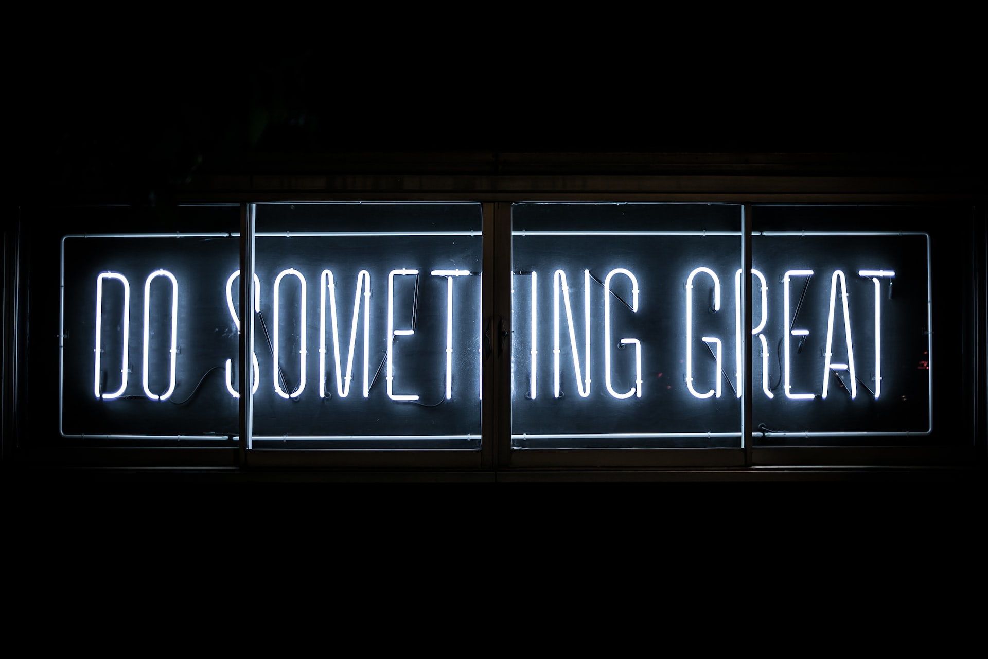 Neon lettering spelling "Do something Great"